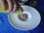Montaggio: Polipo su passatina di ceci al rosmarino con granella di pane croccante - aggiunta di olio