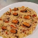 -Fregola risottata con cozze e pepite di piselli - -