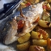 -Orata macchiata al forno con spicchi di patate in camicia - -