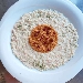 -Risotto con crema di gorgonzola, salmone e lime servito con bottarga e melograno - -