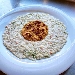 -Risotto con crema di gorgonzola, salmone e lime servito con bottarga e melograno - -