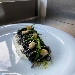 -Spaghettone al nero di seppia con vongole veraci e salicornia su spuma di cacio e pepe - -