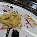 -Tagliatelle di crepes con meringa dorata servita con salsa al cioccolato ed amarena - -