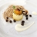 Cilindri di patata ripieni di creme brl di parmigiano, uovo di quaglia caramellato, champignon disidratati, farina di porcini e champignon, brunoise di tartufo nero glassato - -