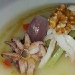 Crema parmentier e seppia scottata alle noci servita con ortaggi croccanti  - -