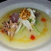 Crema parmentier e seppia scottata alle noci servita con ortaggi croccanti  - -