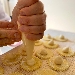 Gnocchi di patate farciti al pecorino, fave e guanciale, cipolla rossa salsa all'uovo arancia e tartufo nero - -