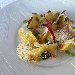 Gnocchi di patate farciti al pecorino, fave e guanciale, cipolla rossa salsa all'uovo arancia e tartufo nero - -