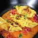 Ravioli ripieni di baccal e patate con riduzione di pomodoro fresco, polvere di gambero rosso, semi di papavero e germogli di barbabietola rossa - -