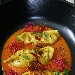 Ravioli ripieni di baccal e patate con riduzione di pomodoro fresco, polvere di gambero rosso, semi di papavero e germogli di barbabietola rossa - -