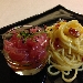 Spaghetti trafilati al bronzo, aglio di Cervia, mosto d'olio e peperoncino ligure con dadolata di tonno Marsala - -
