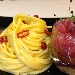 Spaghetti trafilati al bronzo, aglio di Cervia, mosto d'olio e peperoncino ligure con dadolata di tonno Marsala - -