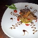 Costolette d'agnello con tortino di carciofi - -