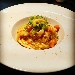 Risotto mantecato all'onda con zucca, calamari e mandarino - -