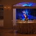 Resort Oleandri (Paestum - SA) - La luce argentea degli ulivi al di l delle vetrate contrasta con quella nei caldi toni dell'ambra che all'interno della sala crea un'atmosfera intima e ovattata, una dimensione quasi sospesa